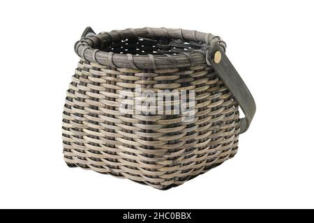 Dark wicker vintage rustic basket, isolated on white background. Stock Photo