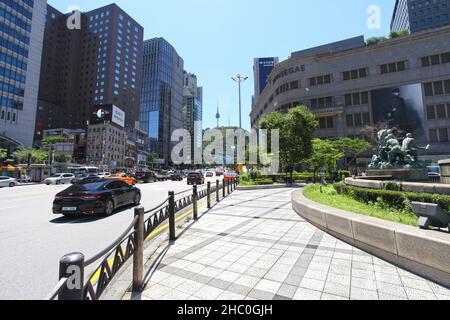 Outside Shinsegae department store and near Seoul Central Post Office in Seoul, South Korea with Seoul Tower in the background. Stock Photo