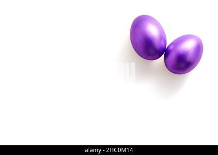 Purple easter eggs on white background with copy space for text. Colour of the year 2022. Stock Photo