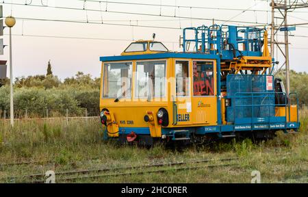 Locomotive wagons for railway line maintenance parked on a siding Stock Photo