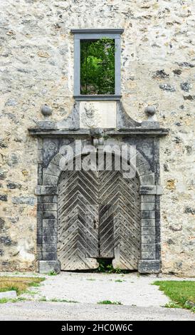 Lukovica, Slovenia - July 5, 2021: Splendid old doors in the stone walls, which are remains from the old castle in Slovenia Stock Photo