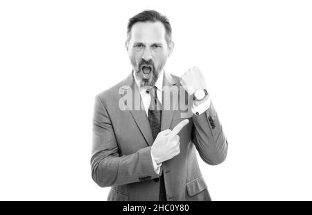 angry mature director in suit pointing finger on time on watch isolated on white, late. Stock Photo