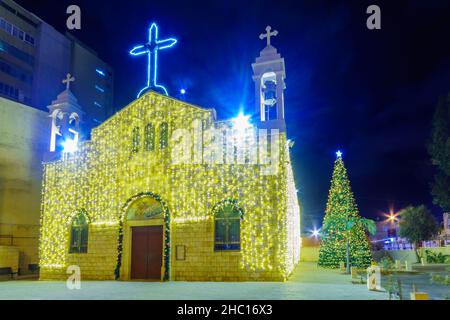 View of the Greek-catholic St. Elijah Cathedral (St. Elias Greek-Melkite, Mar-Elias), with Christmas Tree and holiday decorations, in downtown Haifa, Stock Photo