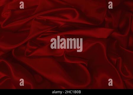 Rich and luxury red silk fabric texture background. Top view. Stock Photo