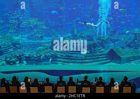 Haikou, China's Hainan Province. 21st Dec, 2021. A contestant participates in a mermaid contest in Sanya, south China's Hainan Province, Dec. 21, 2021. Over 40 contestants participated in the contest which kicked off Tuesday. Credit: Pu Xiaoxu/Xinhua/Alamy Live News Stock Photo