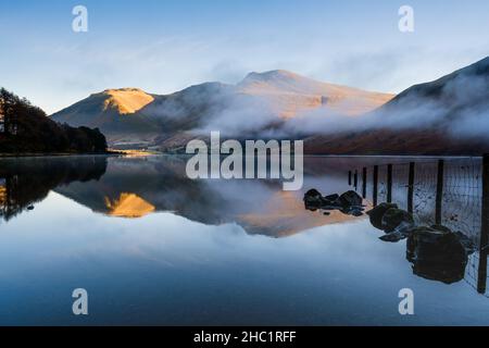 Wastwater & the Scafell Range on a calm & cool misty morning in the Lake District, UK Stock Photo