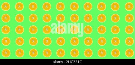 Lemon slices, top view of lemon slices isolated on a green background. Citrus pattern concept photo. Stock Photo