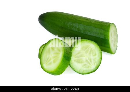 Cucumber slices, closeup photo of ripe cucumber slices isolated on white background. Stock Photo