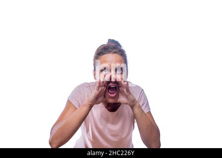 A woman screaming with her hands in her mouth Stock Photo