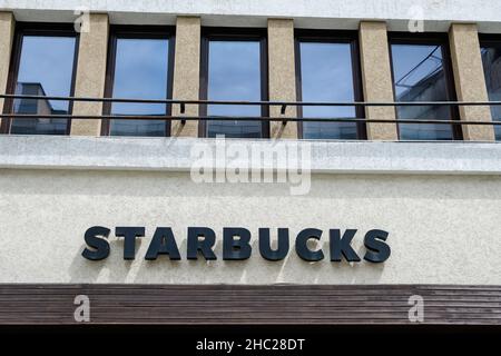 Bucharest, Romania - June 6, 2020: Entry sign with logo for Starbucks cafe location Stock Photo