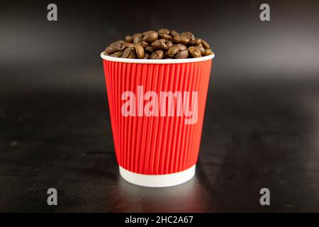 Coffee beans in a red paper cup Stock Photo