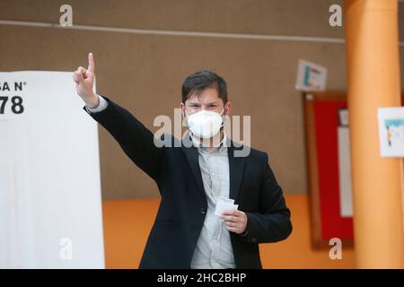 (211220) -- PUNTA ARENAS, Dec. 20, 2021 (Xinhua) -- Left-leaning candidate Gabriel Boric Font casts his ballot at a polling station in Punta Arenas, southern Chile, Dec. 19, 2021. Gabriel Boric Font won the Chilean presidential election on Sunday, after his rival -- right-wing candidate Jose Antonio Kast -- conceded, making him the youngest elected president in Chile's history. (Xinhua) Stock Photo