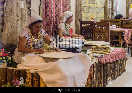 BAKU, AZERBAIJAN - JUNE 20, 2018: Preparation of traditional meal qutab in the center of Baku, Azerbaijan Stock Photo