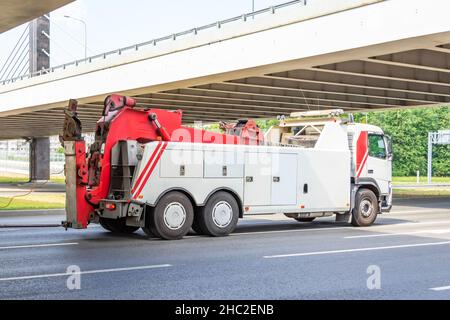 Powerful heavy duty big rig mobile tow semi truck with emergency lights and towing equipment Stock Photo