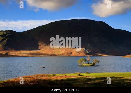 A tiny islet in Crummock Water. Stock Photo