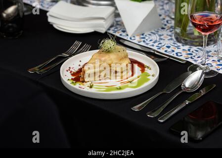 Francesinha, traditional Portuguese sandwich originally from Porto. Served in a restaurant Stock Photo