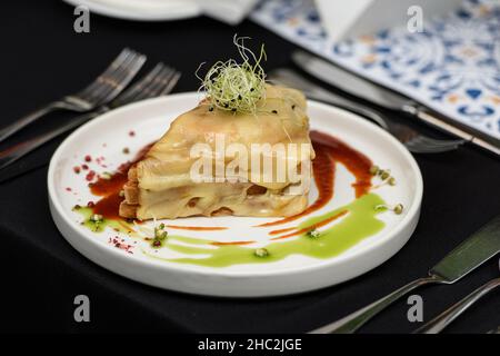 Francesinha, traditional Portuguese sandwich originally from Porto. Served in a restaurant Stock Photo