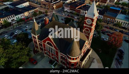 Aerial view at sunset of Historic 1844 Courthouse with clock tower in the center of the Monroe Square, 'Swiss cheese capital', Monroe, Wisconsin, USA Stock Photo