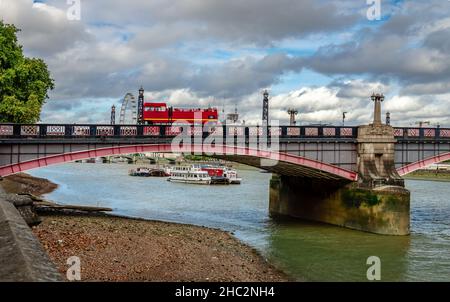 Lambeth Bridge from Millbank. It is a road traffic and footbridge crossing the River Thames in an east-west direction in central London. Stock Photo