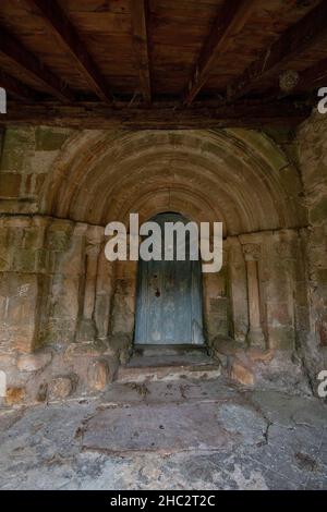 Door of the Romanesque church of Santa Juliana in Aldueso Stock Photo