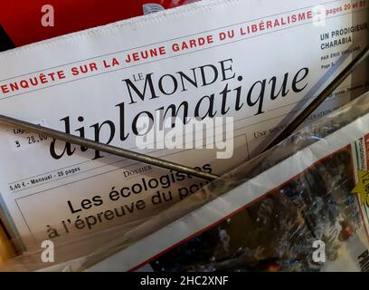 Bucharest, Romania - December 22, 2021: A Le Monde diplomatique newspaper is exposed on a newsstand in a boutique in Bucharest. This image is for edit Stock Photo