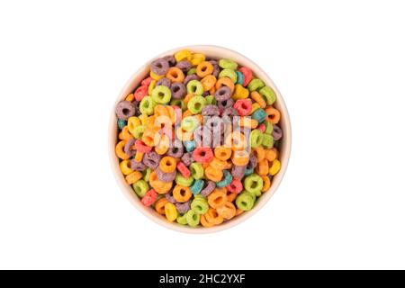 Colorful rings cereal spill out into a bowl. Breakfast. Isolated on a white background. Stock Photo