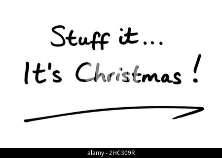Stuff it… Its Christmas! handwritten on a white background. Stock Photo