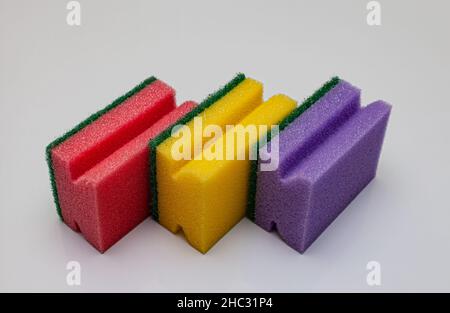 multicolored sponges for washing dishes on a white background. High quality photo Stock Photo