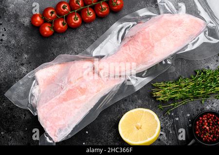 Red Snapper frozen pack fish meat set, with herbs, on white stone table ...