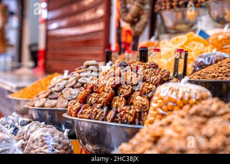 Healthy dates, figs, walnuts and dried apricots in abundance for sale Stock Photo