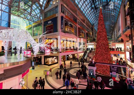 Toronto Eaton Centre during christmas decoration. Crowd people shopping here during covid-19 pandemic period. Stock Photo