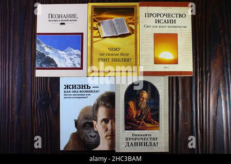 Russia - December 2020: Religious literature of Jehovah's Witnesses (organization banned in Russia). Books of the early 2000s in Russian Stock Photo