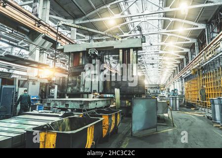 Interior of big industrial metalworking factory building with steel machinery, metallurgical plant. Stock Photo