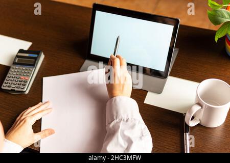 Woman using digital tablet with digital pencil, businesswoman or student. Working from home concept Stock Photo