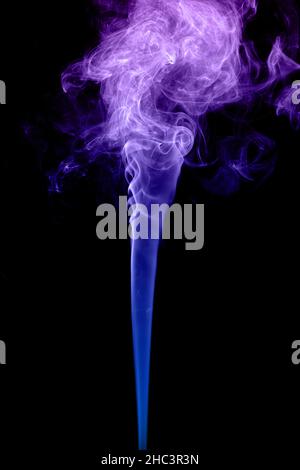 Clouds of curls of colored smoke on a black background Stock Photo