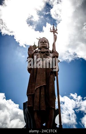 Low angle shot of the statue of Ganga Talao in Mauritius Stock Photo