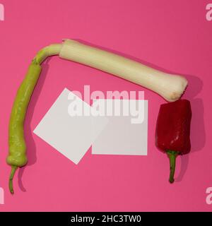 Spring fresh vegetables arranged on a pink background. Flat lay food. Stock Photo