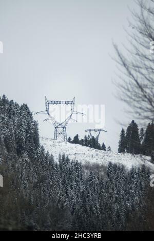 electricity pylon on a mountain which covered with snow Stock Photo - Alamy