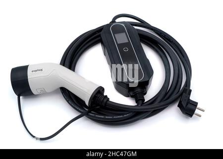 Electric vehicle charging cable - type 2 granny cable charger - cut out isolated on white background Stock Photo