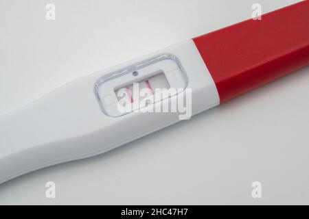 Positive pregnancy test close up on white background Stock Photo