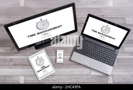 Time management concept shown on different information technology devices Stock Photo