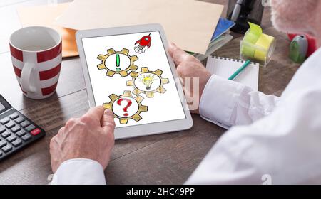 Problem solving concept shown on a tablet held by a man Stock Photo
