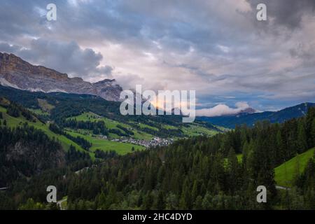 aerial view on sunset in the cloudy dolomites mountains Stock Photo