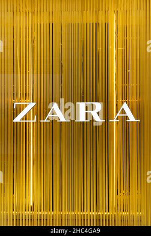 Logo of high street fashion retailer Zara in the store display window, Oxford Street, London, UK Stock Photo