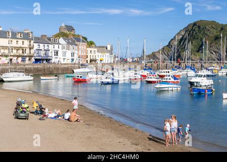 Ilfracombe beach with The Chapel of St Nicholas above the fishing boats and yachts in the harbour and town of Ilfracombe Devon England UK GB Europe Stock Photo