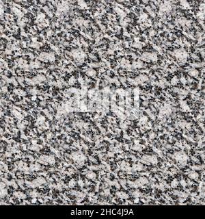 Seamless texture of granite, close-up. Natural black and white granite. Four fragments in one. Top view. Stock Photo