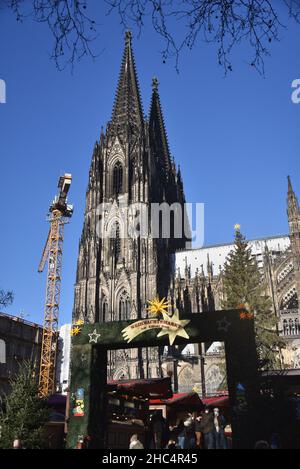 Cologne, Germany. 21st Dec, 2021. Entrance to the Christmas market at Cologne Cathedral. Credit: Horst Galuschka/dpa/Alamy Live News Stock Photo