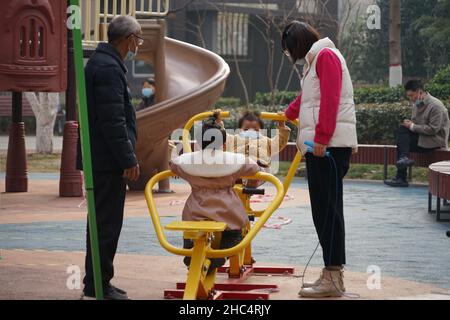 XI'AN, CHINA - DECEMBER 24, 2021 - Residents exercise in a gated community in Xi 'an, Shaanxi Province, China, Dec. 24, 2021. Stock Photo