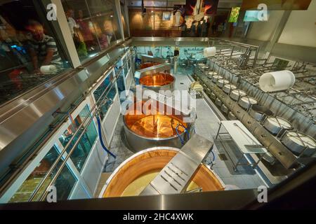 Visiting Gruyere cheese factory and museum, Switzerland Stock Photo