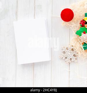 Christmas Concept. gingerbread in the form of a Christmas wreath lies on a white wooden background Stock Photo